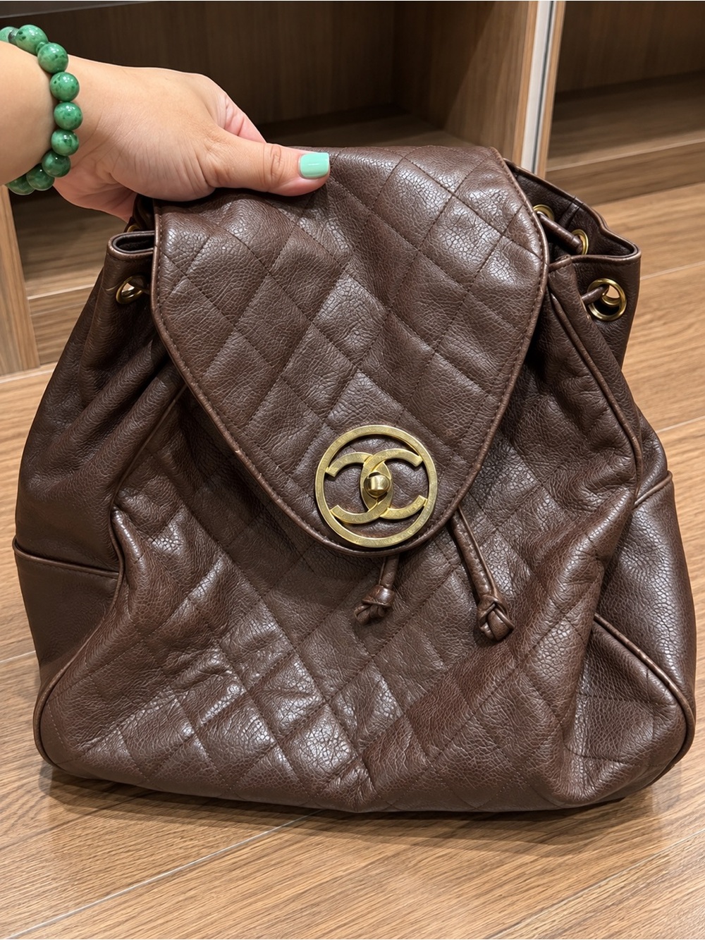 CHANEL Brown Quilted Drawstring Backpack with Gold CC Hardware